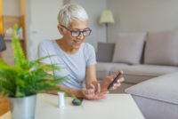 Woman checking blood sugar