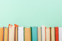 Books on teal background Books on teal background