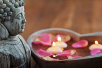 buddha statue and flowers