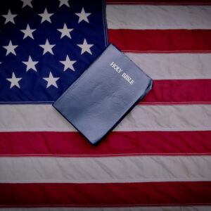 Bible lays on top of the American flag