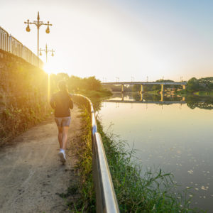 Woman running for exercise to boost immune system and ward off sickness