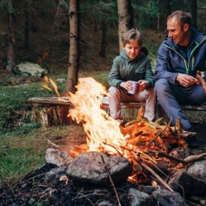 Father and son at bonfire