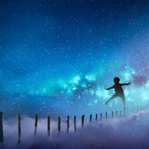 Boy balancing on sticks a starry night