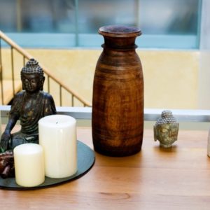 Building an altar with a Buddha statue and candles