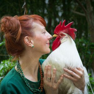 Woman with her rescue rooster pet