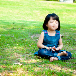 A child practices mindfulness