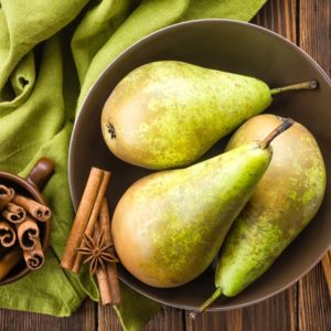 Pears and cinnamon on table