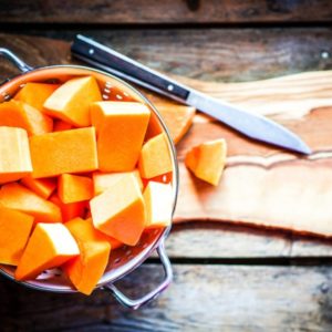 Cut pumpkin on wood surface