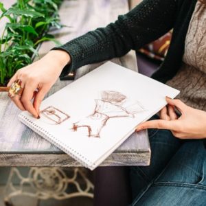 Woman drawing on wood table