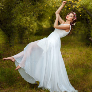 Girl floating and dreaming under flowers