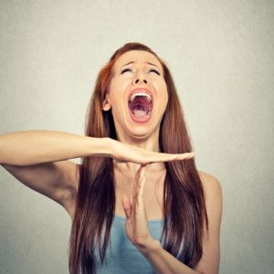 Emotional woman using time-out gesture