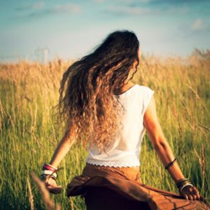 Woman running free in field