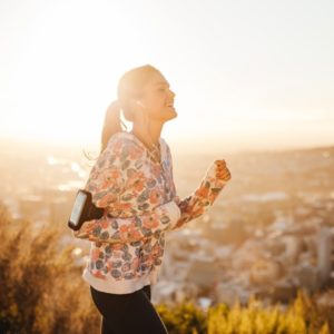 Woman listens to music on morning run