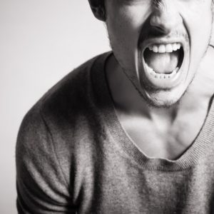 man yelling black and white