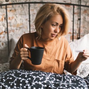 Woman hydrating and resting in a healing crisis