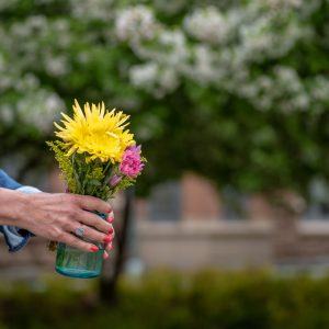 offering flowers in a glass vase