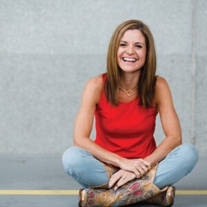 Image of Glennon Doyle Melton wearing red shirt and cowgirl boots