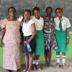 Teacher and students at Glory Value School