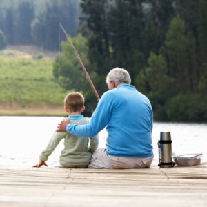 Grandpa fishing with son