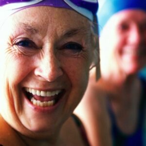 Happy older woman at pool