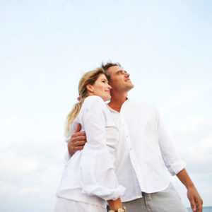 Happy couple on the ocean