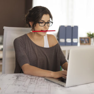 A woman works at her desk