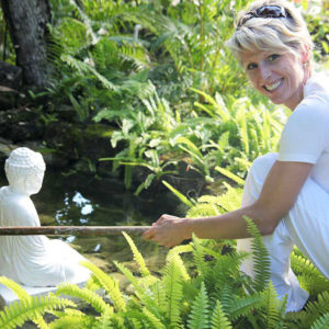 Woman performing karma yoga at Sivananda Ashram Yoga Retreat Bahamas