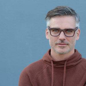 Attractive man with glasses illustrates the concept of mindful sexuality