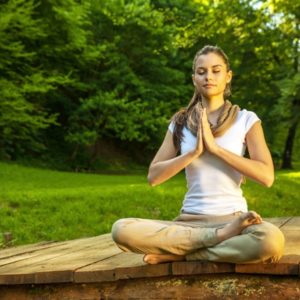 Woman meditating in nature