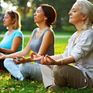 Woman practicing meditation outside