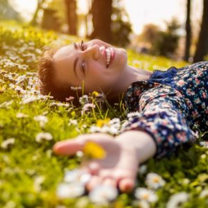 Happy woman in grass