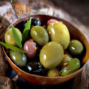 Assortment of olives in wood bowl