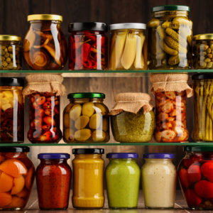 Variety of pickled vegetables in jars