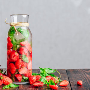 <img src="pitcher with strawberries.jpg" alt="Bottle of Detox Water Infused with Fresh Strawberry and Basil Leaves"/>