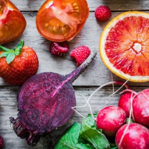 Red foods on wooden table