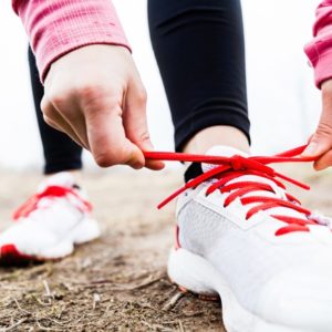 White running shoes with red laces