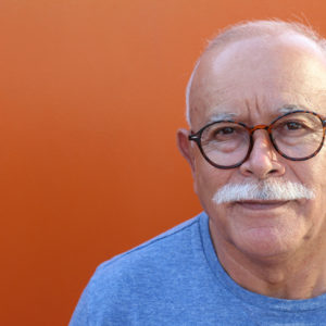 An older man with glasses