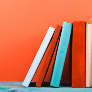 Bright books on orange wall