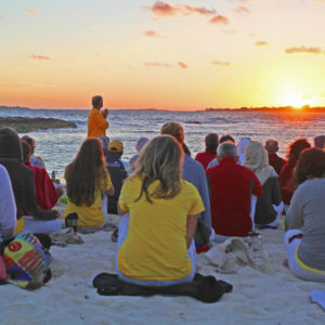 Retreat participants on beach at Sivananda Ashram Yoga Retreat Bahamas