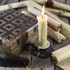 Box with candle and scrolls