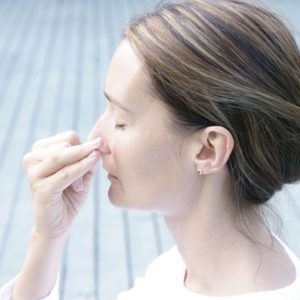 woman doing alternate nostril breathing