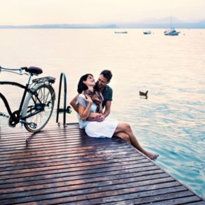 Couple sitting together on dock