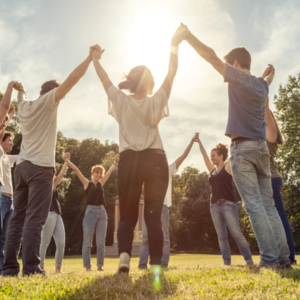 Group holding hands in support