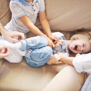 Little girl being tickled