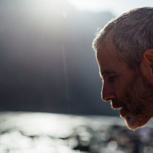 headshot of Tommy Rosen on the Ganges River