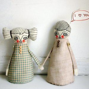 Image of two dolls holding hands