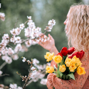 Woman looking at flowers