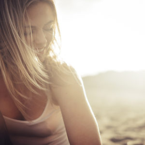 A young woman smiles, the sun behind her: Spirituality and Sexuality