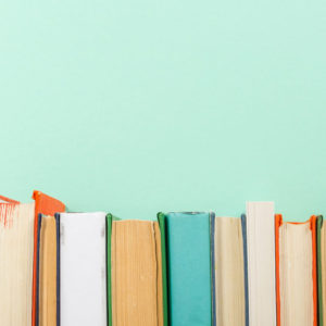 Books on teal background