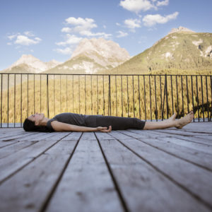 Elena Mironov laying in corpse pose yoga nidra on the brain